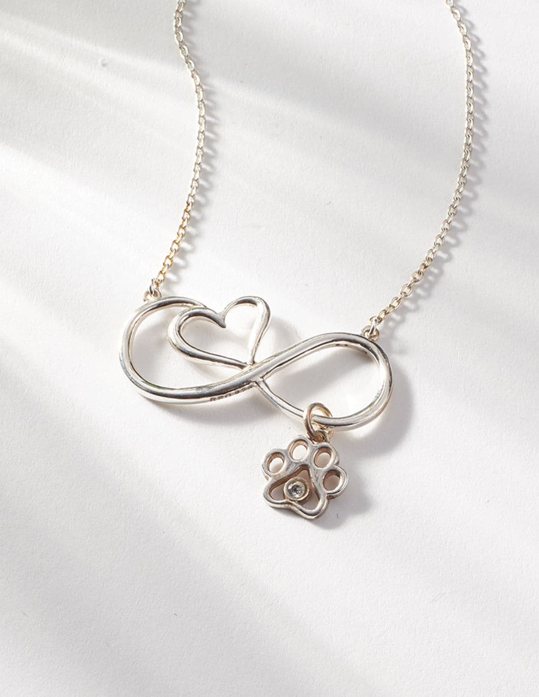 infinity-heart-pendant-with-paw-and-crystal